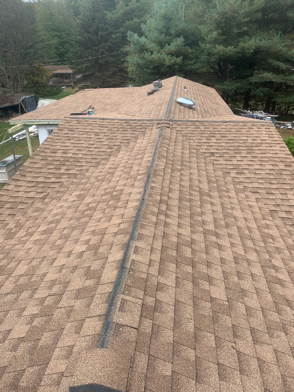 Completed shingle roof viewed from the ridge