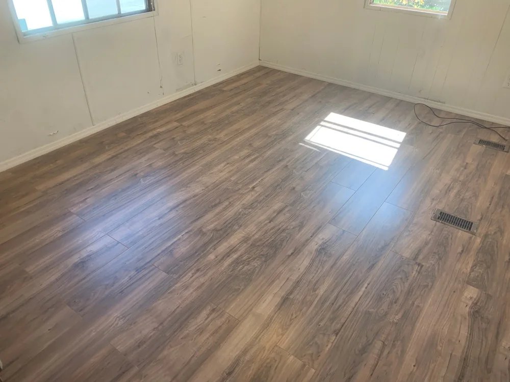 Finished room with new flooring and bright painted walls