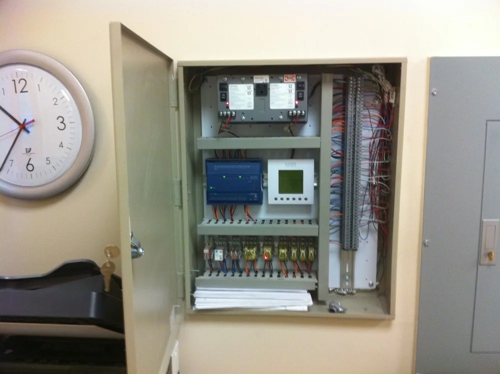 Completed HVAC automation panel with labeled wiring and controls