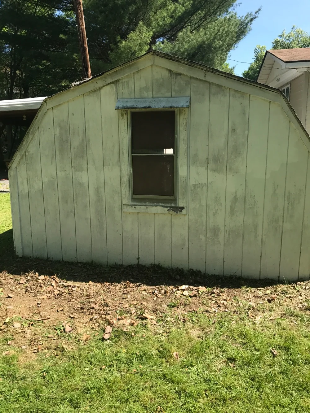 Aging backyard outbuilding before removal