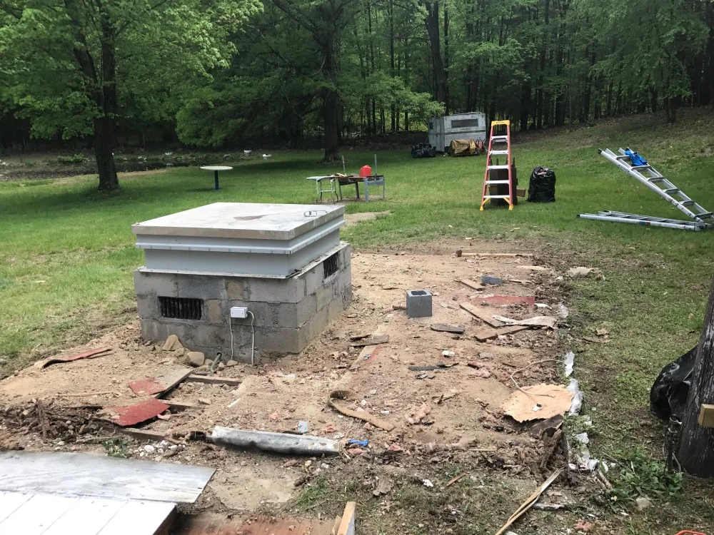 Outbuilding area cleared after most of the structure was removed