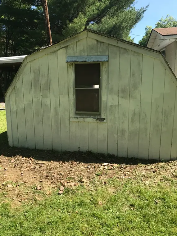 Outbuilding before cleanout and removal